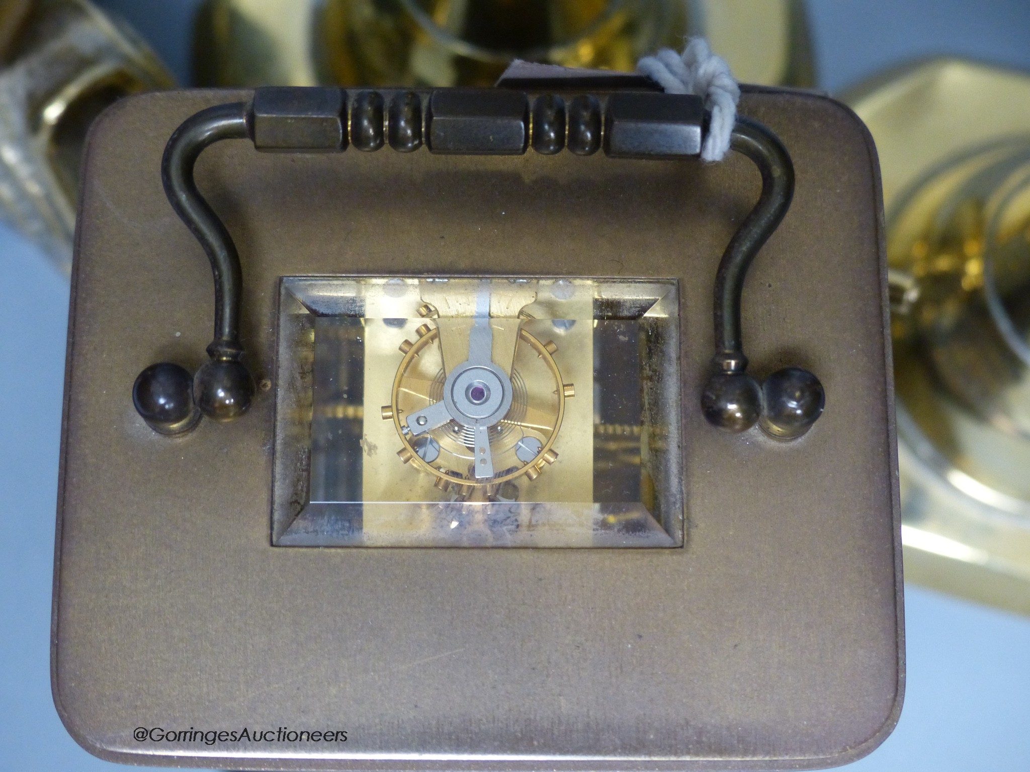 A Matthew Norman brass carriage clock, No.1754 together with a pair of brass candlesticks and a table lamp